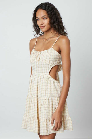 Cute yellow vacation mini dress with tiered skirt