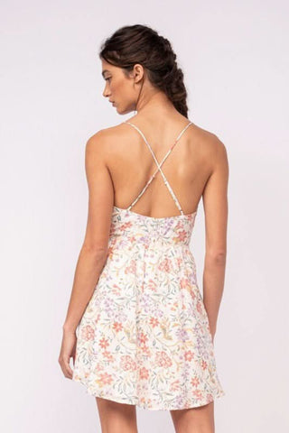 Back view of white floral corset mini dress with delicate cami straps