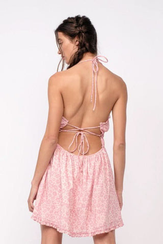 Pink floral mini dress with flowy skirt and open back detail