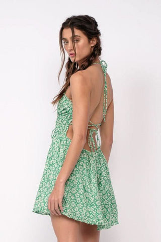 Backless green floral halter dress with adjustable crisscross straps