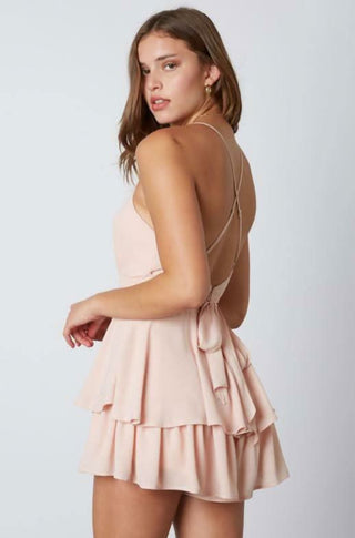 Blush pink feminine ruffle romper back view