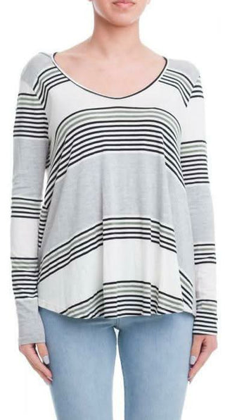 A woman wearing one of our long sleeve striped Tops in olive and grey stripe