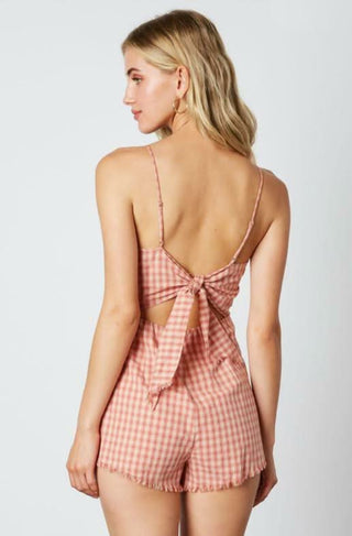 Pink gingham romper with asymmetrical overlap shorts - back view