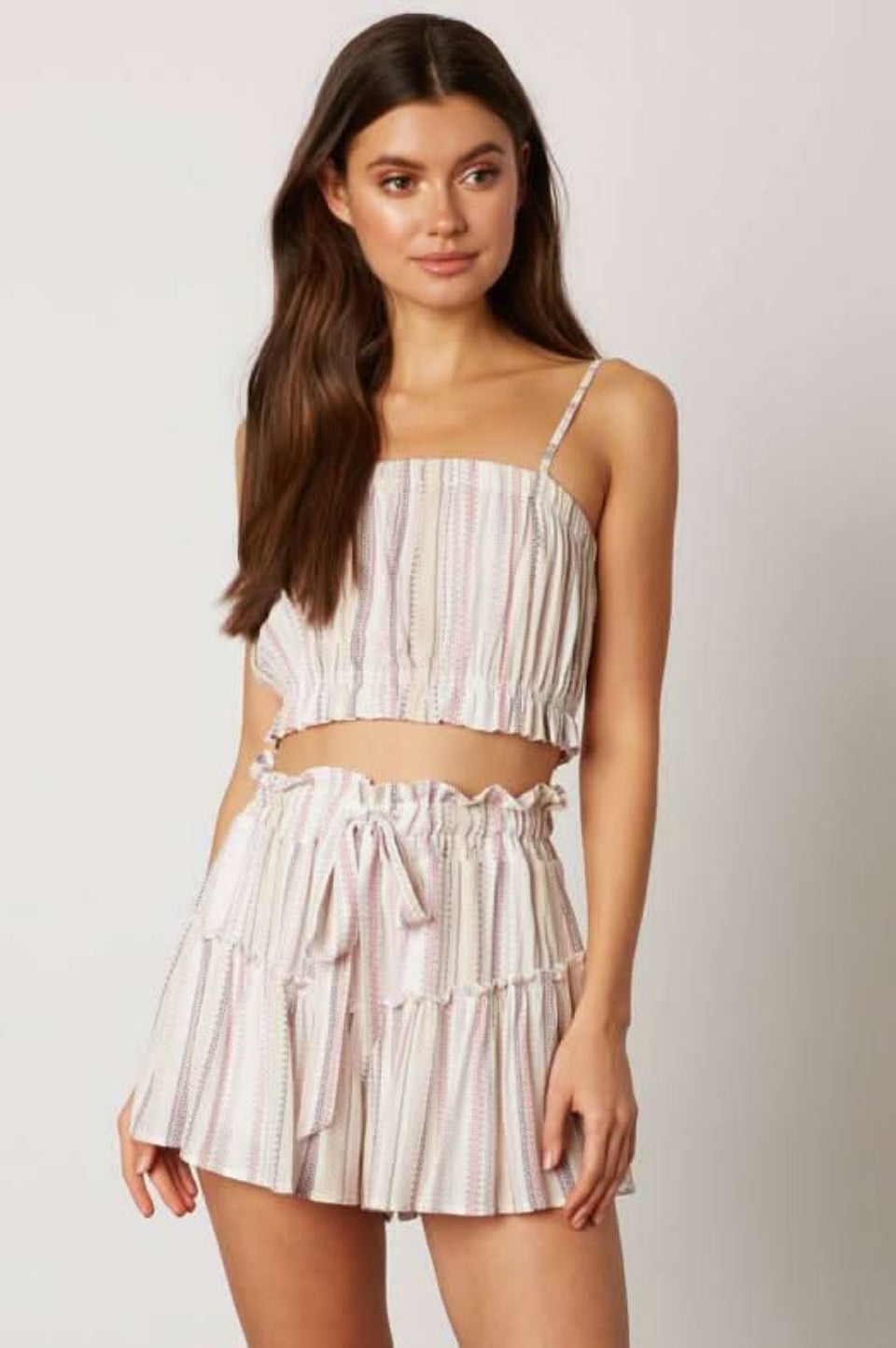 Pink striped crop top and skort set front view