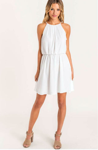 Feeling Flirty Off White Blouson Skater Dress styled with high heels for graduation