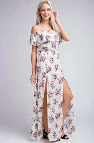 Model wearing the I Adore White Floral Print Off-the-Shoulder Maxi Dress showing double slits