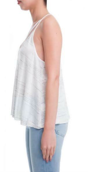 Side View of model posing in the relaxed-fit striped tank top, showcasing the breezy triangle silhouette.
