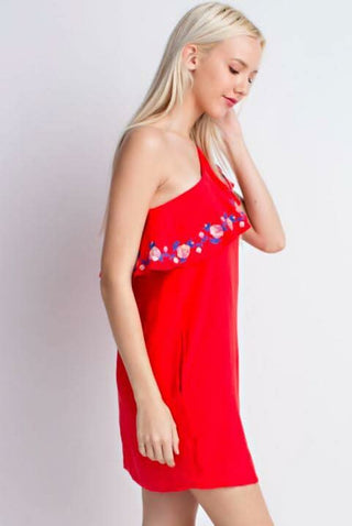 Side view of red one-shoulder dress, showcasing the ruffles