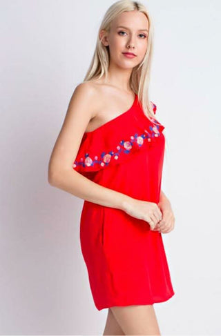 Detail shot of the functional side pockets on the red Southern Bud mini dress.