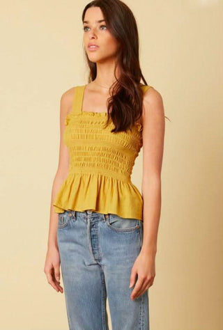 Mustard yellow fashion top paired with jeans