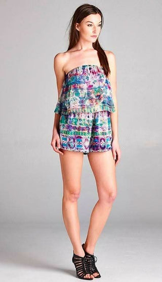 Model wearing a strapless satin jewel tone romper for a tropical vacation outfit 