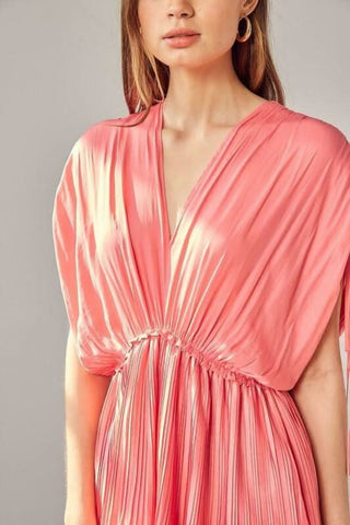 Close-up detail: Milky pink V-neck mini dress with tied dolman sleeves and pleated fabric