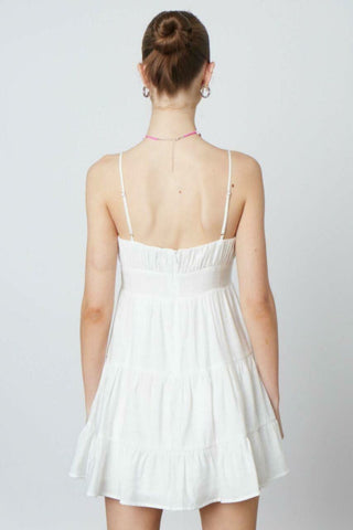 White flowy babydoll mini dress for summer parties - back view