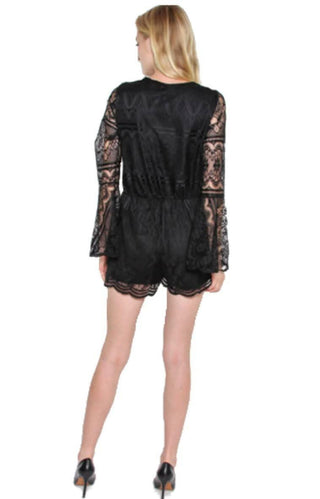 Back view of black lace romper with long bell sleeves and scalloped hem shorts