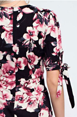 Close up of the Say What You Will Navy Floral Romper