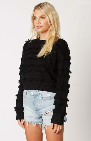 Hailey Black Fringe Sweater styled with distressed denim shorts