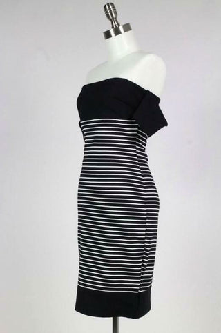 Side view of form-fitting black & white striped midi dress showing hourglass silhouette| Boho Pink