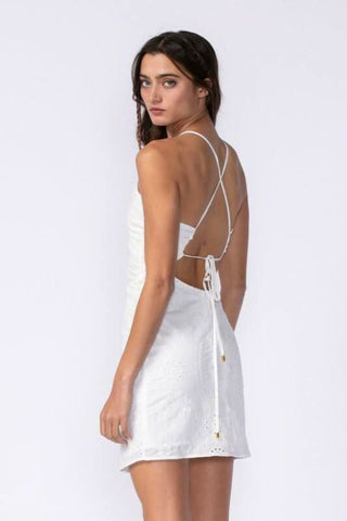 back view of white eyelet lace dress with criss-cross tie straps