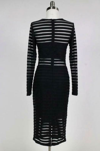 Back view of black shadow stripe textured fabric on a midi dress