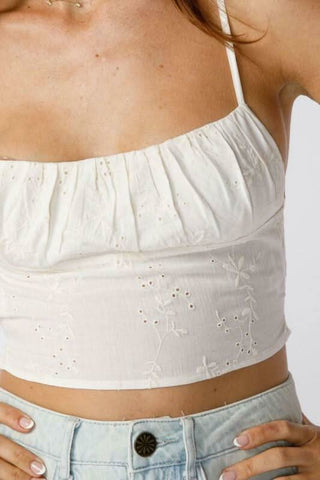 boho white eyelet crop top styled with jeans