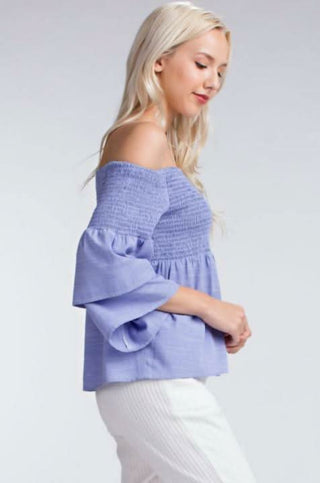 blue smocked off the shoulder top side view