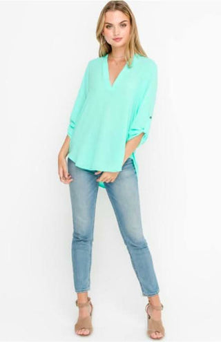 See That Girl Mint Green Roll Tab Sleeve Top styled with jeans and high heels