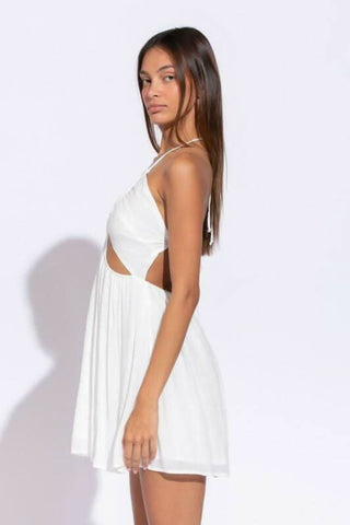 Side view of Monika White Cutout Halter Mini Dress showing cutout waist