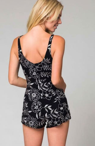 Back view of black bodycon romper with silver metallic embroidery and a slim-fit silhouette.