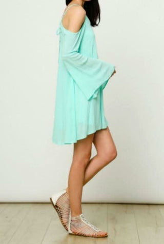Flowy mint mini dress featuring cold shoulder cutouts and tiered bell sleeves for a bohemian beach look