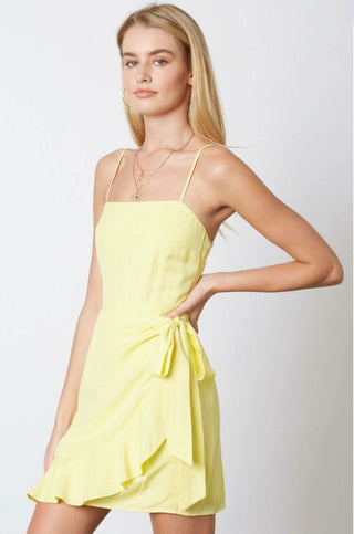 Yellow ruffle hem mini dress side view