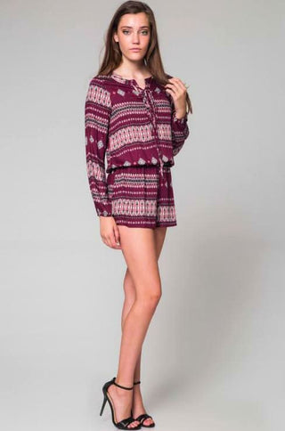 Full outfit view of burgundy long sleeve romper