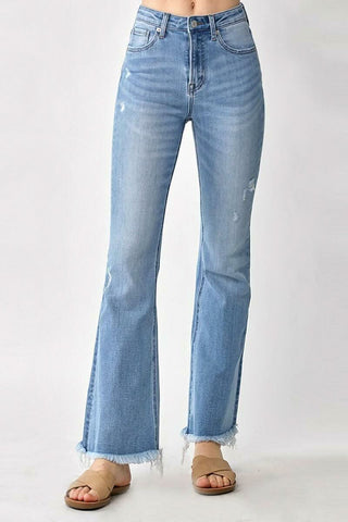Model wearing high rise Vintage-Wash Flare Jeans with frayed hems