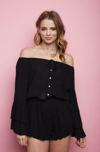 Model wearing Full Moon black off-the-shoulder romper with blouson fit and tiered bell sleeves | Boho Pink