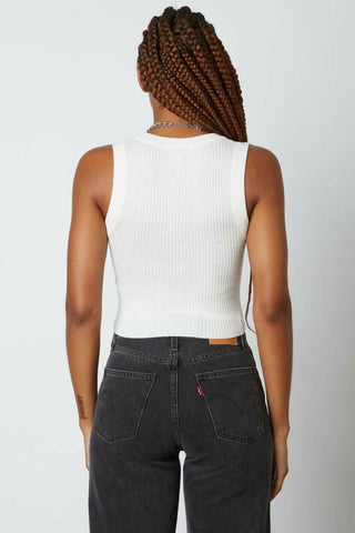 Back view of a white cropped sweater vest featuring a clean sleeveless silhouette 
