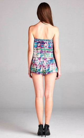 Back view of a strapless romper showing the elastic waist and breezy vacation fit 