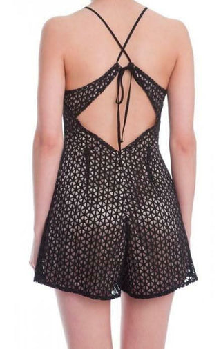 Detail shot of the crisscross tie-back closure on a black lace dressy romper with champagne lining | Boho Pink
