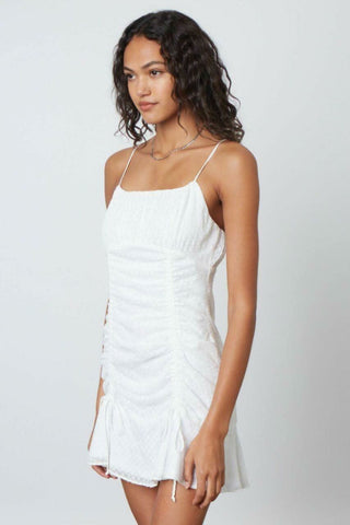 White mini dress with adjustable drawstring ruching