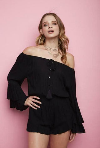 Close-up of black rayon fabric and long ruffle bell sleeves on Cotton Candy LA romper | Boho Pink
