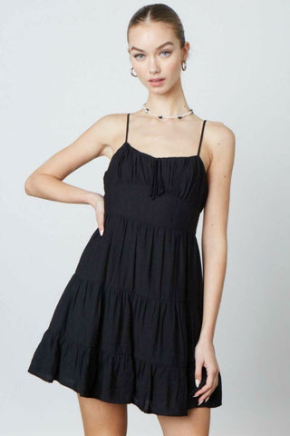 Black babydoll dress with flared mini skirt