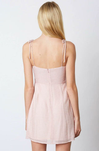 Pink graduation mini dress with self tie straps - back view