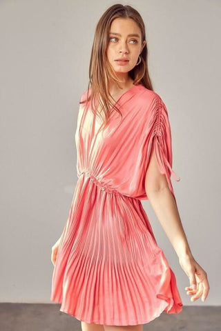 Side view: Milky pink pleated mini dress with dolman sleeves and empire waist