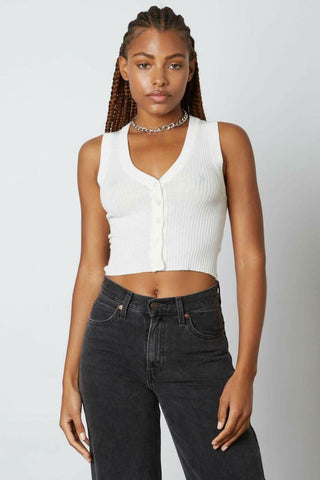 Woman wearing the Little Bit of Sweetness white cropped button-down sweater vest 