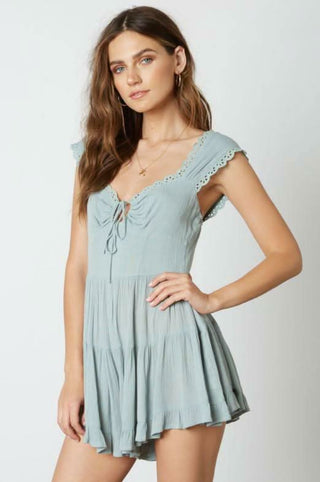 Seafoam blue romper with sage green undertones - side angle