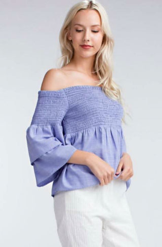 blue smocked off the shoulder top front angled view