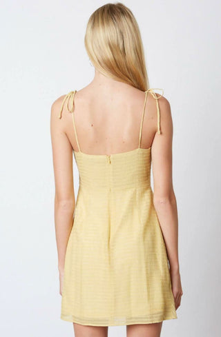 Yellow ruffle tie strap mini dress back view