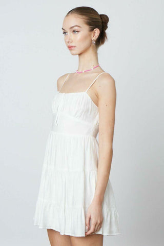 White flowy babydoll mini dress for summer parties - side view