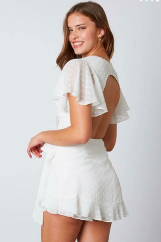 White ruffle hem romper back view