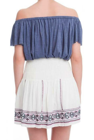 Rear view of the Sophie flared mini skirt showcasing the high-waisted fit and embroidery placement.