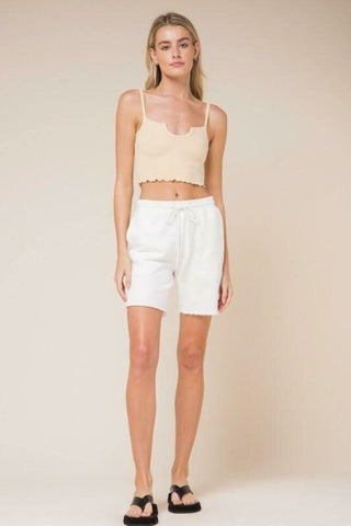 Don't Do It Vanilla Notch Cami Crop Top styled with thong sandals and white shorts