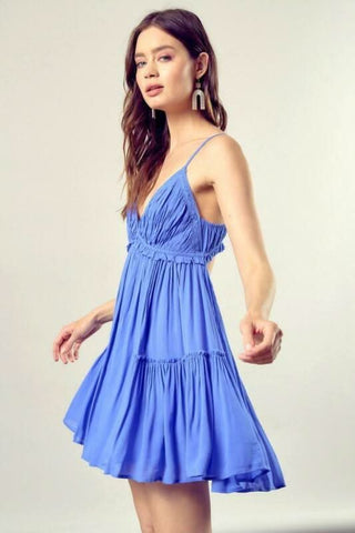 Model wearing periwinkle cami ruffle dress for summer
